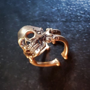Decorative adjustable Cross bone skull Ring.