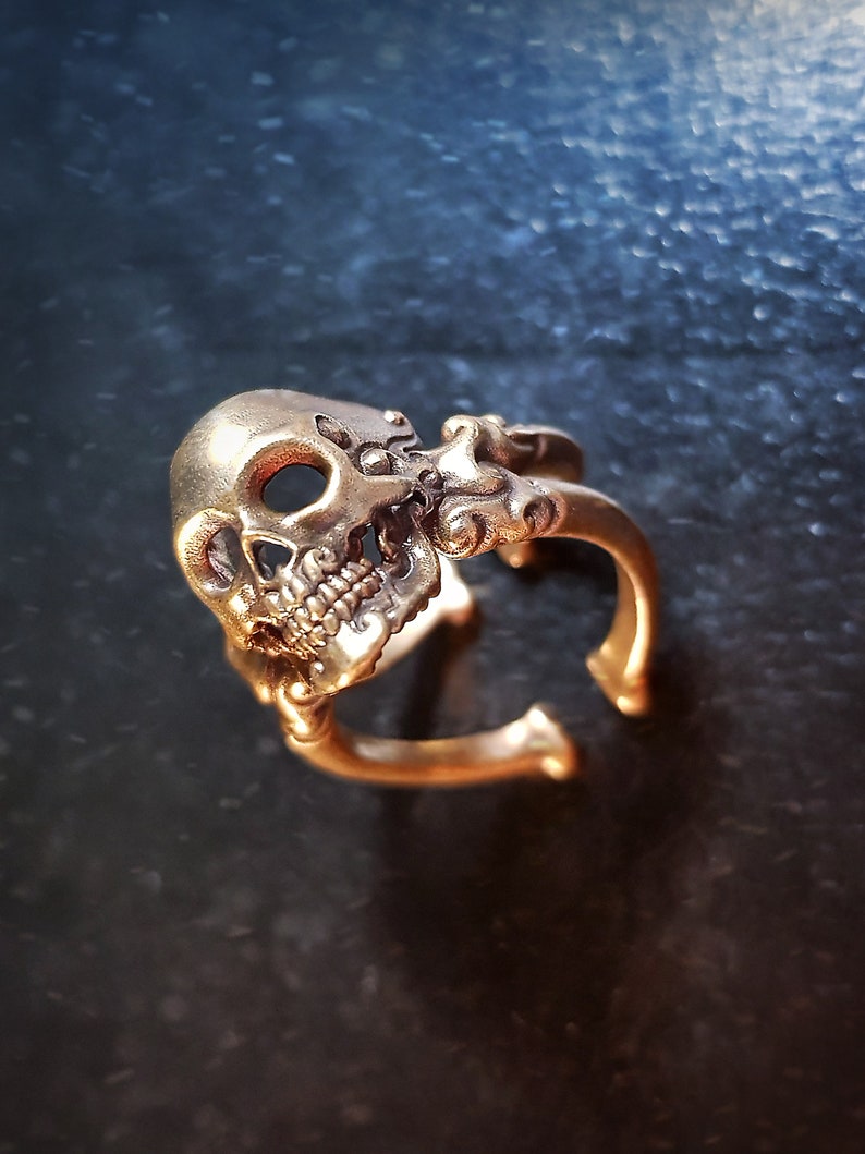 Decorative adjustable Cross bone skull Ring.