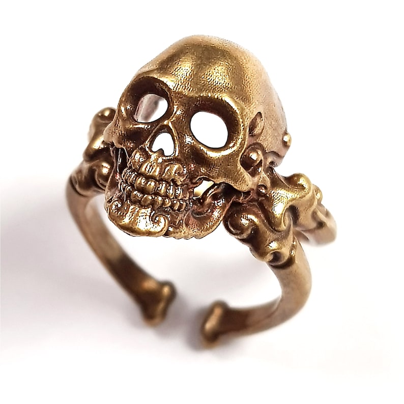 Decorative adjustable Cross bone skull Ring.