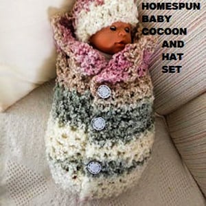 May include: A crocheted baby cocoon and hat set in pink, white, and grey. The set is made with a homespun yarn and features buttons.