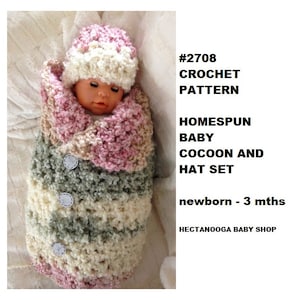 May include: A crocheted baby cocoon and hat set in pink, green, and white with buttons. The set is for newborns to 3 months old. #2708 CROCHET PATTERN HOMESPUN BABY COCOON AND HAT SET newborn - 3 mths HECTANOOGA BABY SHOP