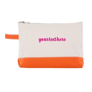 May include: A white canvas zippered pouch with an orange bottom. The pouch has a pink embroidered text that says "yourtextthere".