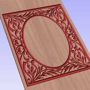 May include: A red wooden frame with an oval cutout in the center. The frame is decorated with a floral design.