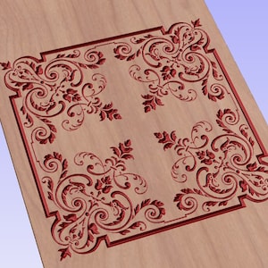 May include: A red decorative design carved into a light brown wooden surface. The design features four repeating patterns of stylized leaves and swirls.