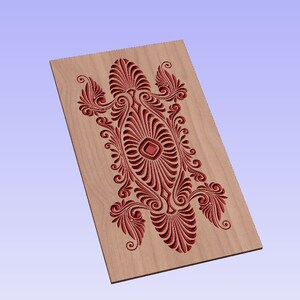 May include: A wooden panel with a carved design in a red color. The design is intricate and features a central diamond shape surrounded by swirling patterns.