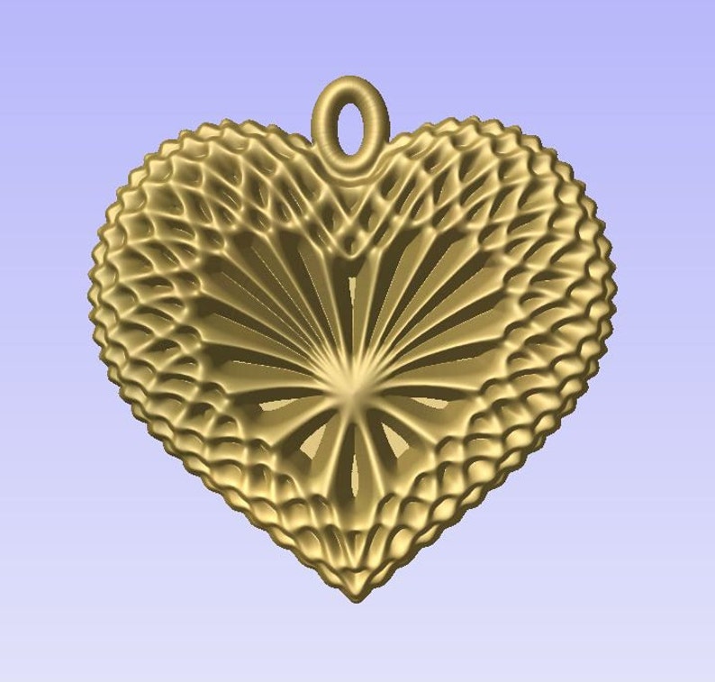 May include: A gold heart-shaped pendant with a delicate, intricate design. The pendant has a loop at the top for attaching a chain.