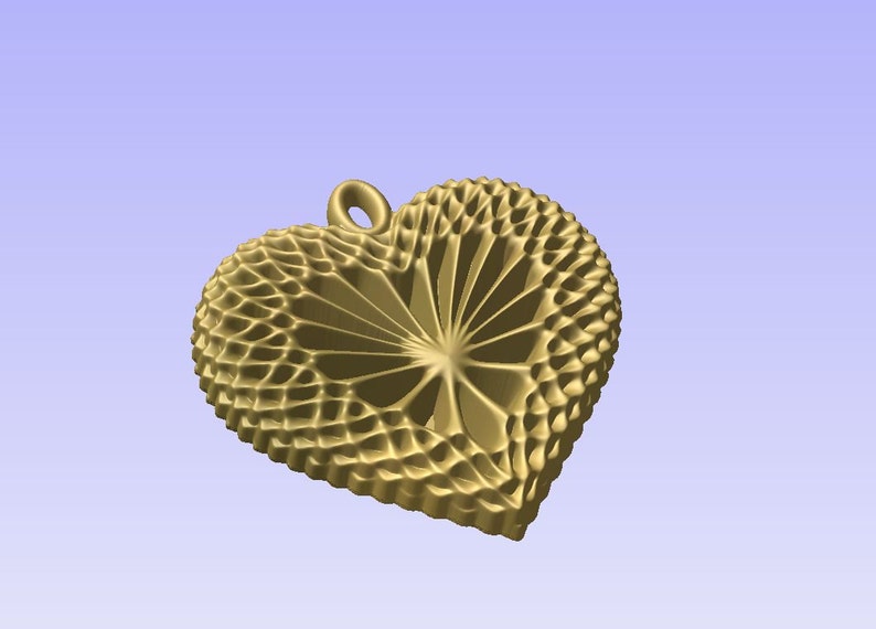 May include: A gold heart-shaped pendant with a detailed, intricate design. The pendant has a loop at the top for attaching a chain.