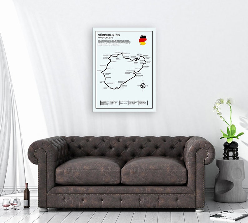 May include: A black and white poster featuring a map of the N&uuml;rburgring Nordschleife race track. The poster also includes the German flag and the text "N&uuml;rburgring Nordschleife".