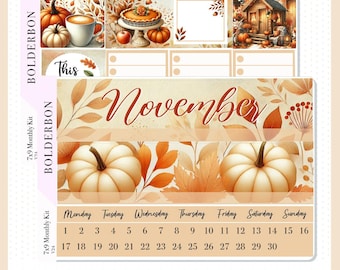 May include: A 7x9 monthly planner kit with a fall theme. The kit features a calendar with the month of November, pumpkins, leaves, and a cozy cabin. The text "This" and "November" are included in the design.