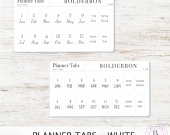 Könnte beinhalten: Weiße Planer-Tabs mit Monatsnamen und Abkürzungen für Januar bis Dezember. Die Tabs sind mit "Planner Tabs" und "Bolderbon" beschriftet.