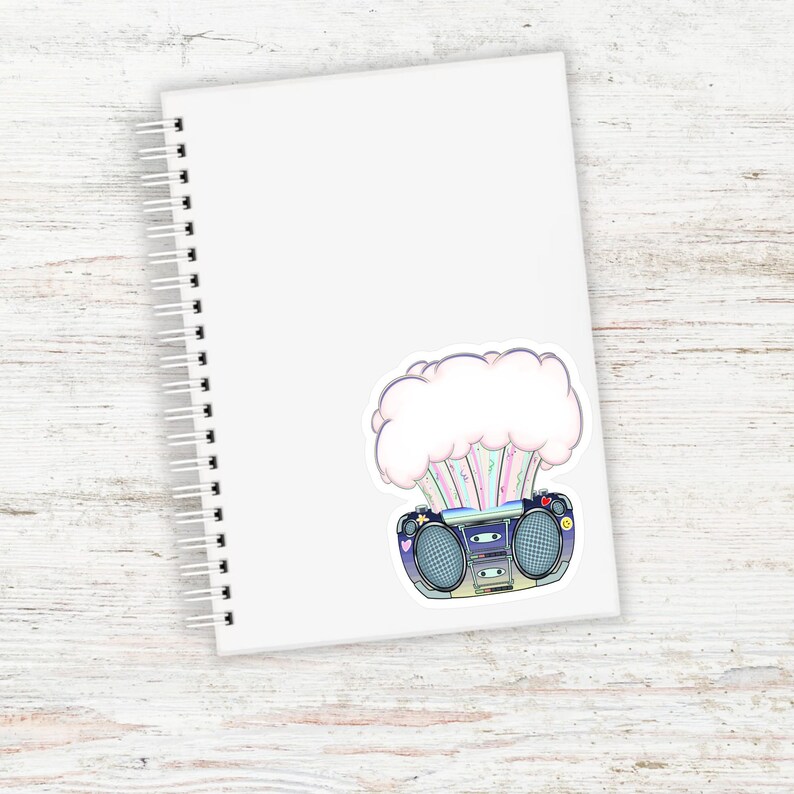 May include: A sticker of a vintage boombox with a cloud of rainbow colored smoke coming out of it.