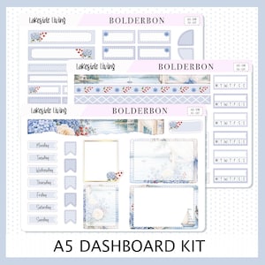 May include: A5 dashboard kit with a Lakeside Living theme. The kit includes stickers and labels with floral and coastal designs in shades of blue, white, and gold. The text includes the days of the week and the words "Lakeside Living" and "BOLDERBON".