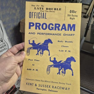 May include: A vintage yellow Official Program from the Kent & Sussex Raceway in Harrington, Delaware. The program features blue illustrations of harness racing horses and text including "Late Double" and "Daily Double".
