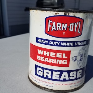 May include: A white can of Farm-Oyl Heavy Duty White Lithium Wheel Bearing Grease. The can has red and blue lettering and a picture of a wheel bearing.