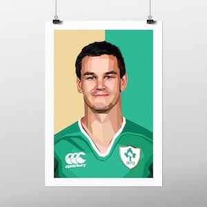 May include: A digital illustration of a rugby player wearing a green jersey with the Canterbury and IRFU logos. The player is smiling and looking at the camera.