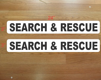 Op de afbeelding: Twee witte rechthoekige borden met zwarte tekst die "SEARCH & RESCUE" luidt. De borden zijn 61 cm lang en 7,6 cm breed.