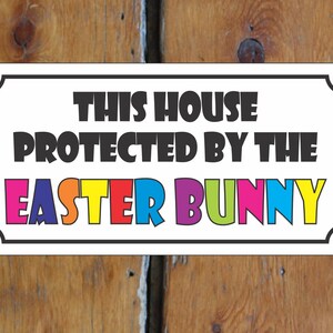 This House Protected by Easter Bunny Metal Sign