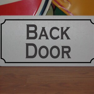 Back Door Metal sign