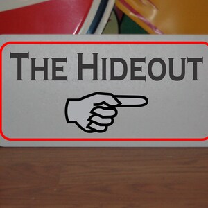 The Hideout Metal Sign