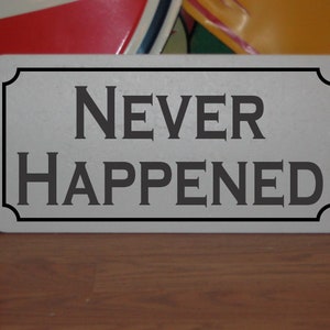 Never Happened Metal Sign