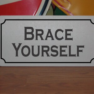 Brace Yourself Metal Sign
