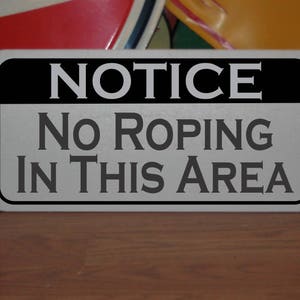 Notice NO ROPING in this AREA Metal Sign