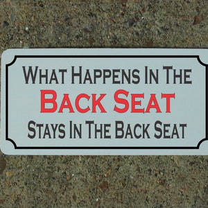 What Happens in the Back Seat Stays in the Back Seat Metal Sign
