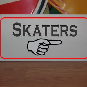 Skaters Metal Sign