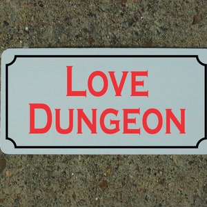 Love Dungeon Metal Sign
