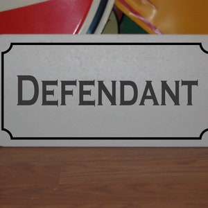 Defendant Metal sign