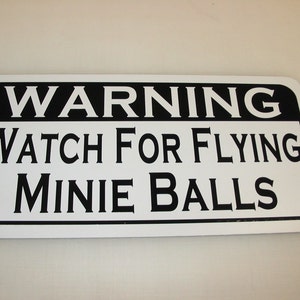 Watch for flying Minie Balls... Metal sign for Farm civil war muskets rifle