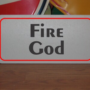 Fire God Metal Sign