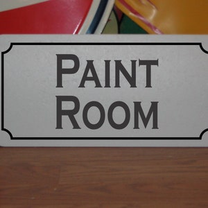 Placa de metal para sala de pintura