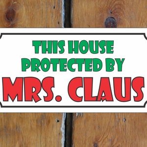 This House Protected by Mrs. Claus Metal Sign