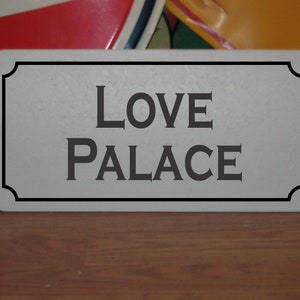 Love Palace Metal Sign