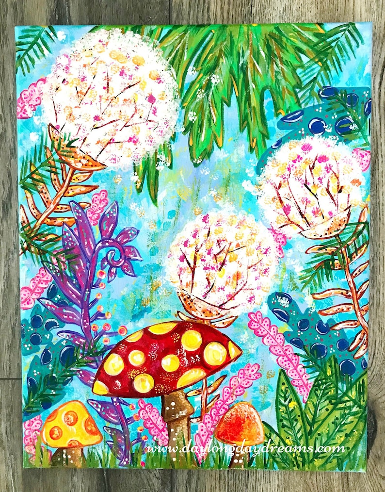 May include: A whimsical painting of a forest scene with large white flowers, green leaves, and colorful mushrooms. The mushrooms are red with yellow dots, yellow with orange dots, and orange with red dots. The background is a light blue with hints of gold glitter.