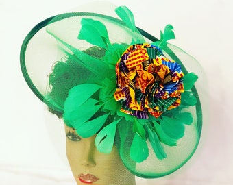 Green Derby African fascinator decorated with kente print fabric feathers and net. Brides and Bridesmaids gift. Mini church hat, Party hat.