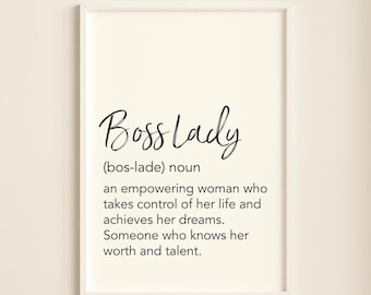 May include: A framed print with a white background and black text that reads "Bosslady (bos-lade) noun an empowering woman who takes control of her life and achieves her dreams. Someone who knows her worth and talent."