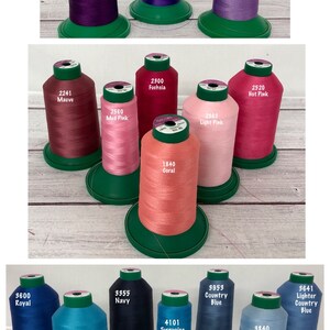 May include: Assortment of spools of thread in various colors, including purple, pink, coral, blue, and aqua. Each spool is labeled with a number and color name.