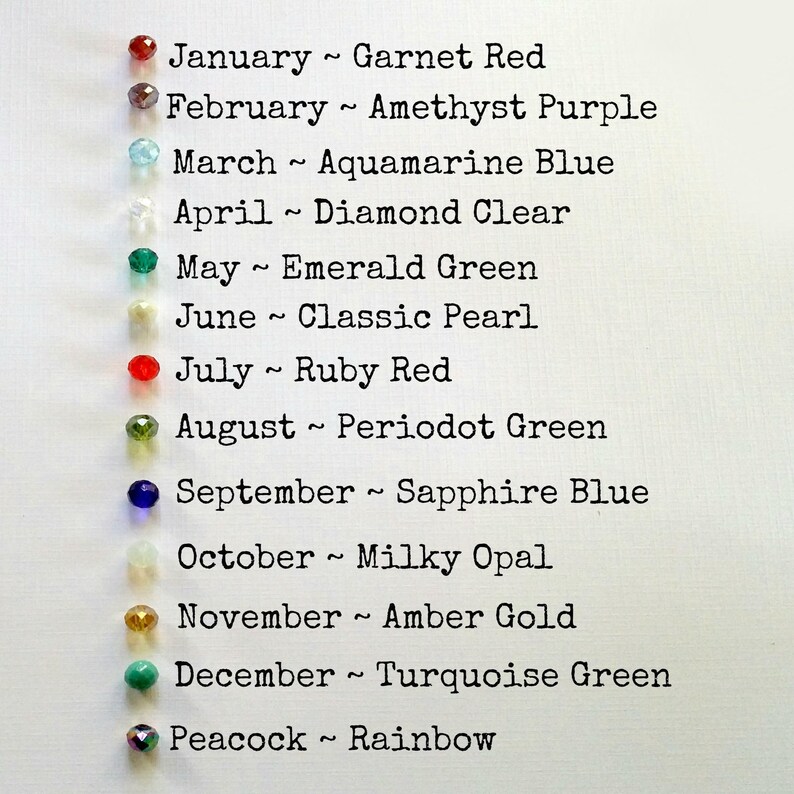May include: A chart listing birthstones for each month of the year. January is Garnet Red, February is Amethyst Purple, March is Aquamarine Blue, April is Diamond Clear, May is Emerald Green, June is Classic Pearl, July is Ruby Red, August is Peridot Green, September is Sapphire Blue, October is Milky Opal, November is Amber Gold, December is Turquoise Green, and Peacock is Rainbow.