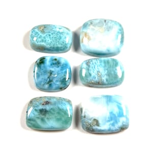 May include: Six smooth, polished, light blue, green, and white, rectangular, cabochon gemstones.