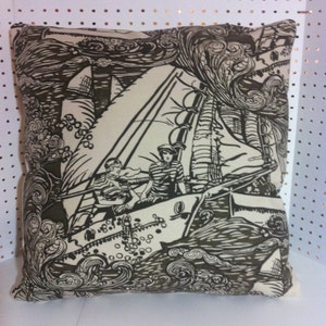May include: A black and white pillow with a nautical theme. The pillow features a sailboat with two people on board, surrounded by waves and clouds. The pillow is made of a soft, comfortable fabric.
