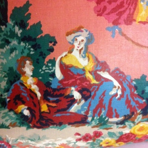 May include: A vintage floral fabric featuring a couple in a garden setting. The woman wears a blue and red dress with a yellow scarf, while the man wears a red and black jacket. The background is a pink floral pattern.