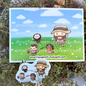 May include: A print and sticker featuring a cartoon illustration of a man with a beard and hat leading three other characters on a leash across a green field under a blue sky with clouds. The print and sticker have the website address annettispaghetti.myshopify.com.