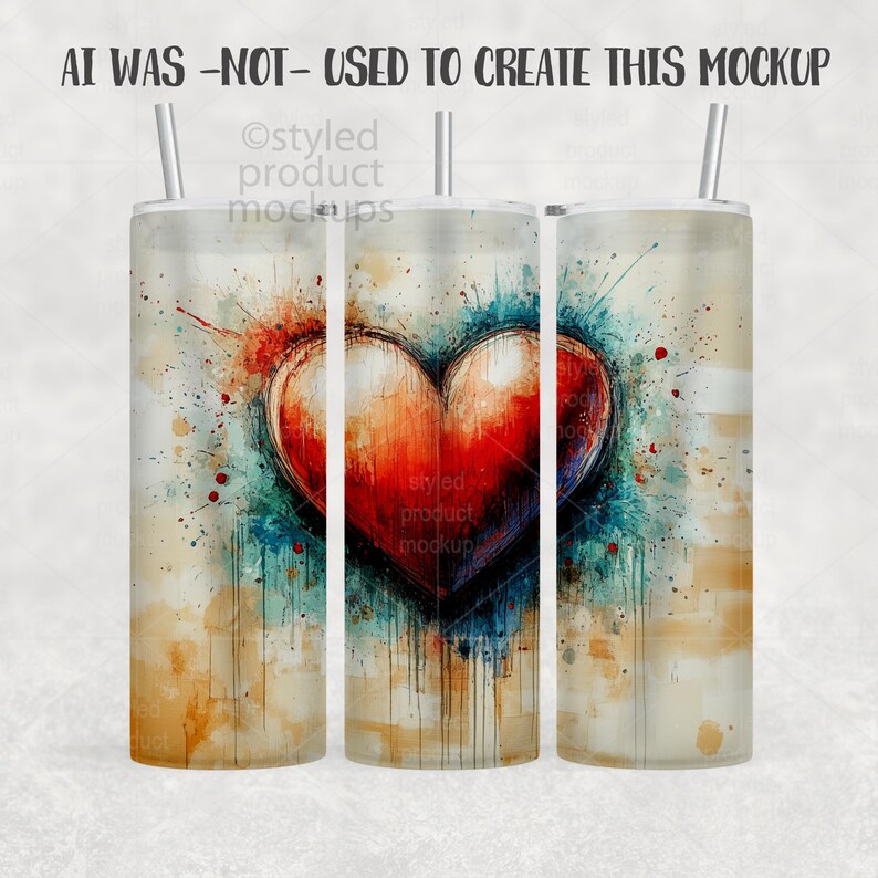 May include: A stainless steel tumbler with a watercolor heart design. The heart is red and orange, with blue and green accents. The text "AI WAS -NOT- USED TO CREATE THIS MOCKUP" is at the top. The tumbler has a straw.