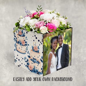 May include: A decorative box with a floral arrangement of white, pink, and green flowers. The box features a wedding cake design on one side and a photo of a couple on another. Text on the bottom reads "EASILY ADD YOUR OWN BACKGROUND."