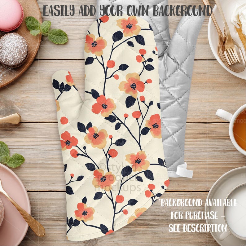 May include: Cream-colored oven mitt with a floral pattern of orange flowers and dark blue stems. The mitt is quilted and has the text "EASILY ADD YOUR OWN BACKGROUND" and "BACKGROUND AVAILABLE FOR PURCHASE - SEE DESCRIPTION".