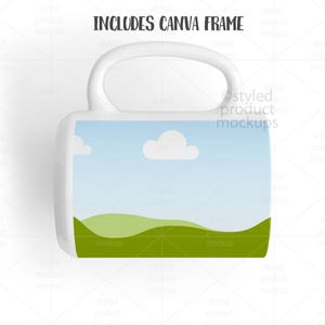 May include: White ceramic mug with a landscape design featuring a blue sky, white clouds, and green hills. The mug has a curved handle and the text "INCLUDES CANVA FRAME" at the top.