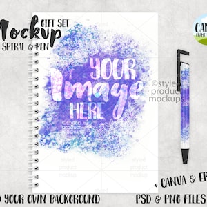 May include: A mockup gift set comprising an A5 spiral notebook and a pen. The notebook has a white cover with a purple and blue watercolour design and the text "YOUR IMAGE HERE". The pen has a matching design. The image includes the text "ADD YOUR OWN BACKGROUND".