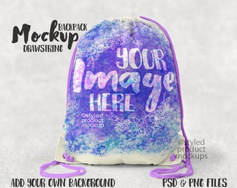 May include: A drawstring backpack mockup with a watercolor design in shades of purple and blue. The text "YOUR IMAGE HERE" is displayed on the front. The bag has a white base and purple drawstring. The words "Mockup DRAWSTRING" are at the top.